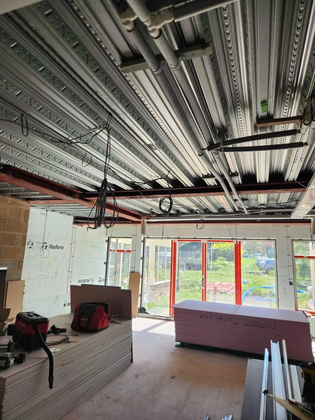 Metal stud framing and MF ceiling to a new commercial space