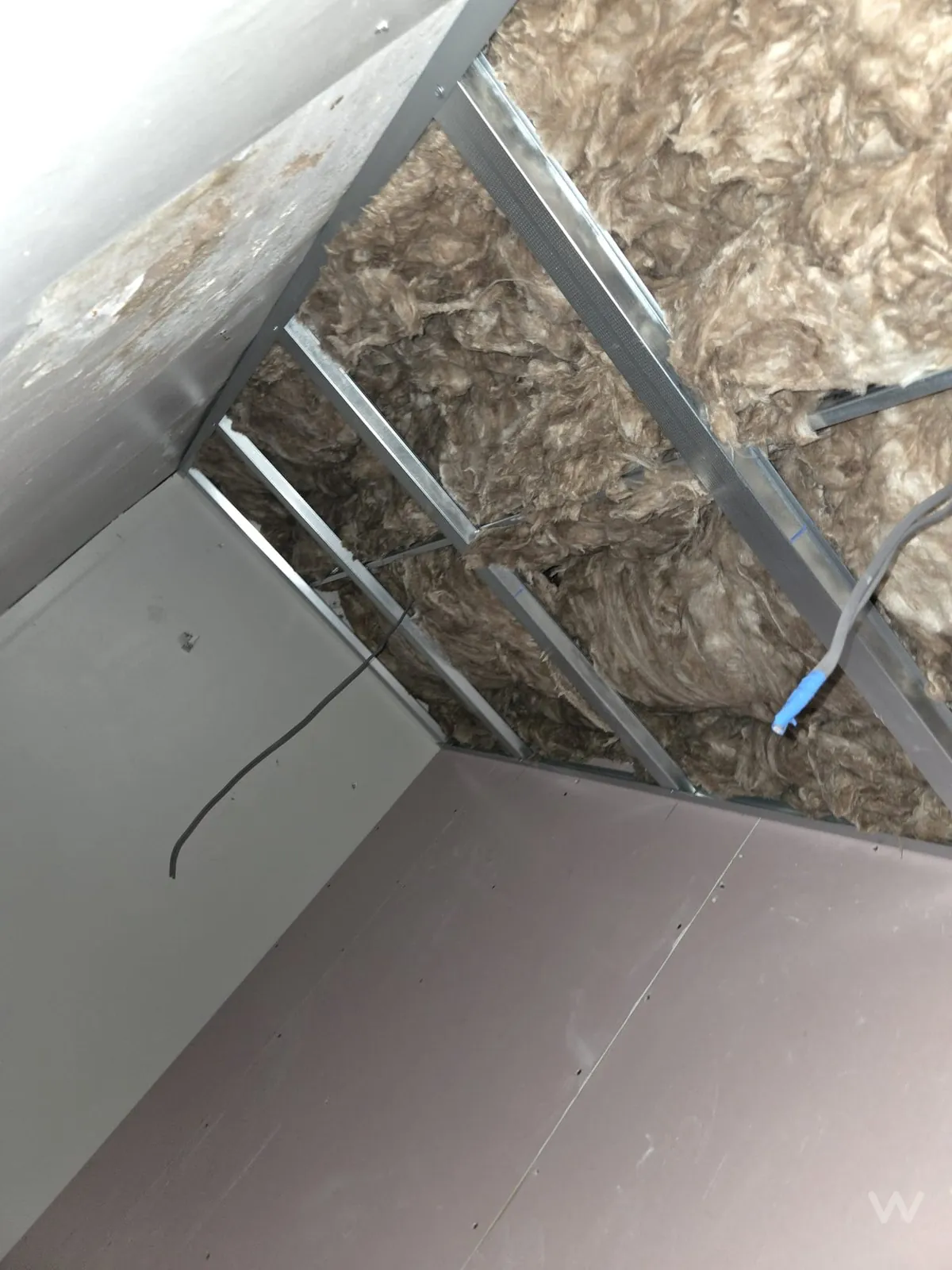 Insulation and services within the ceiling void before boarding