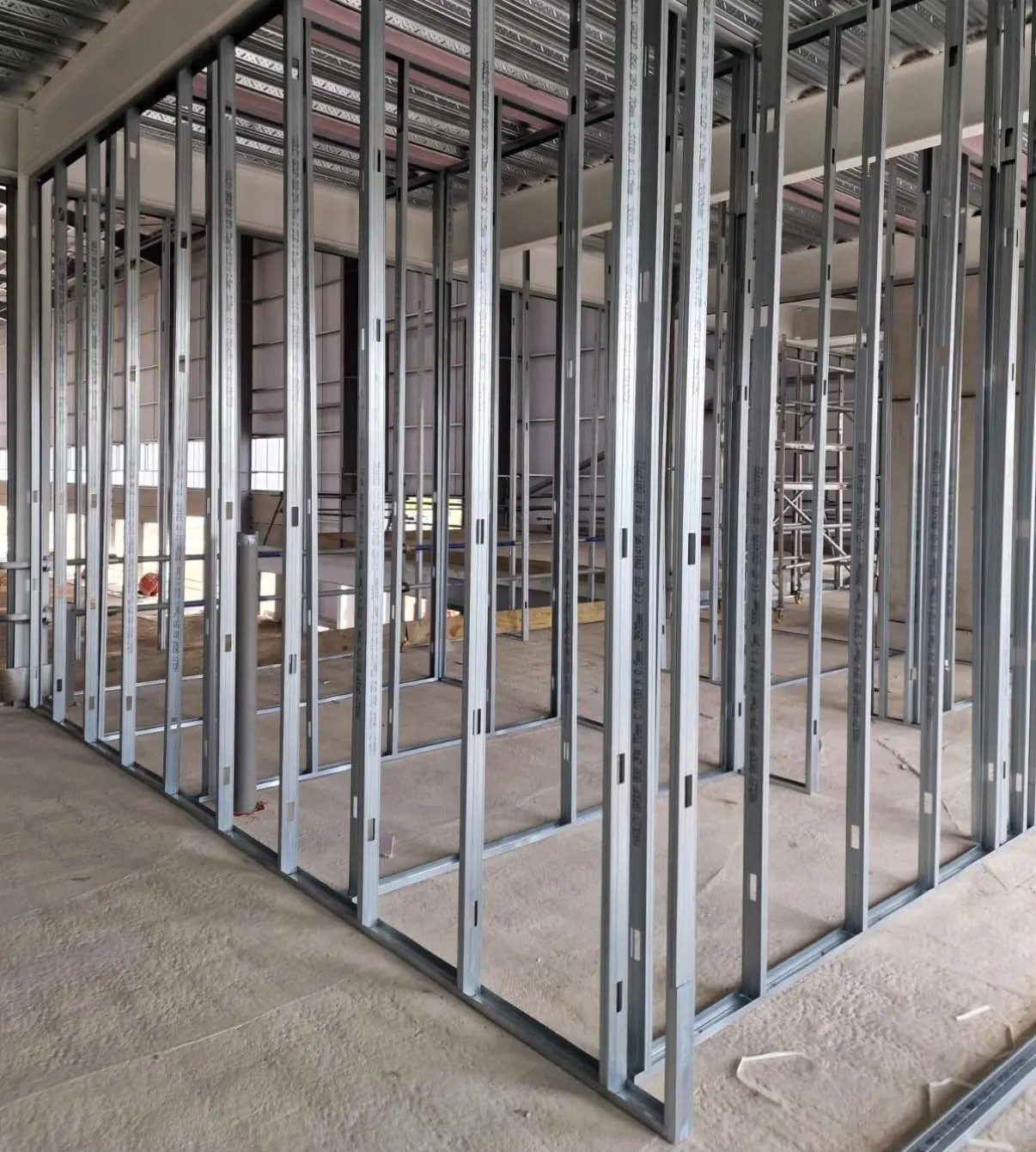 A full metal stud partition layout framed out before boarding on a commercial build